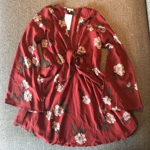 Deep red skater dress w/ sleeves & floral pattern